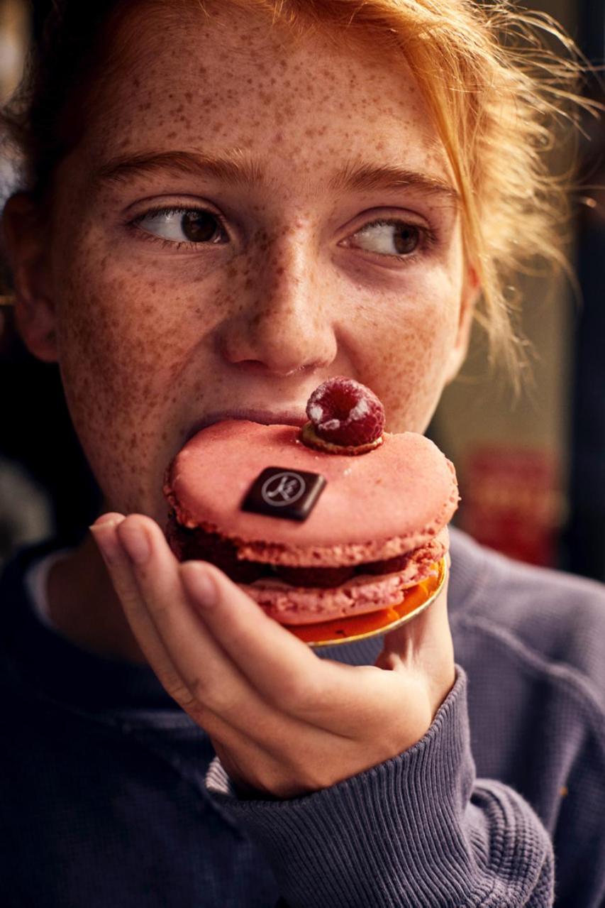 Paris chic, macaron, woman eating macaron